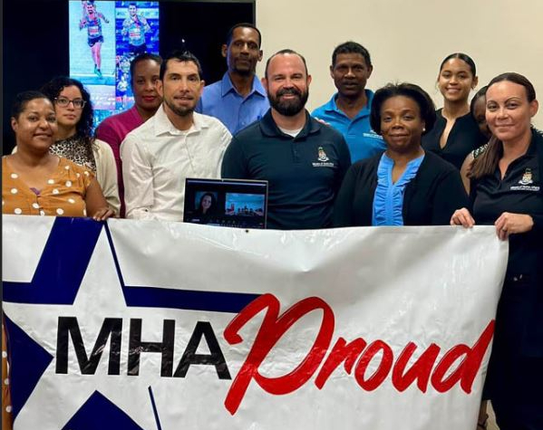 Minister Sabrina Turner with MHA officials